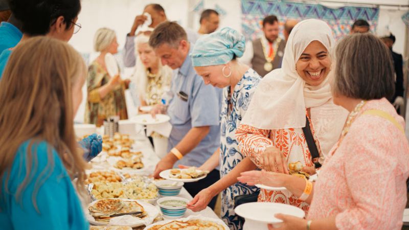 Members of the community enjoying food at the annual Art in the Park Festival.
