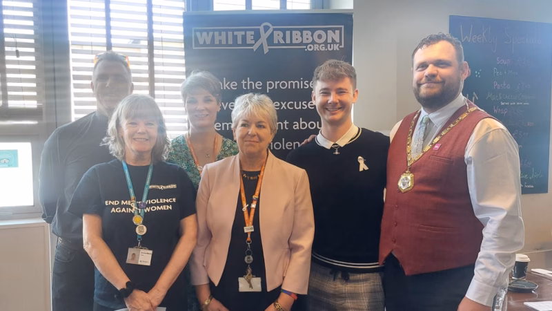 White Ribbon event participants, including Sally Alexander, CEO of MK College Group (centre).