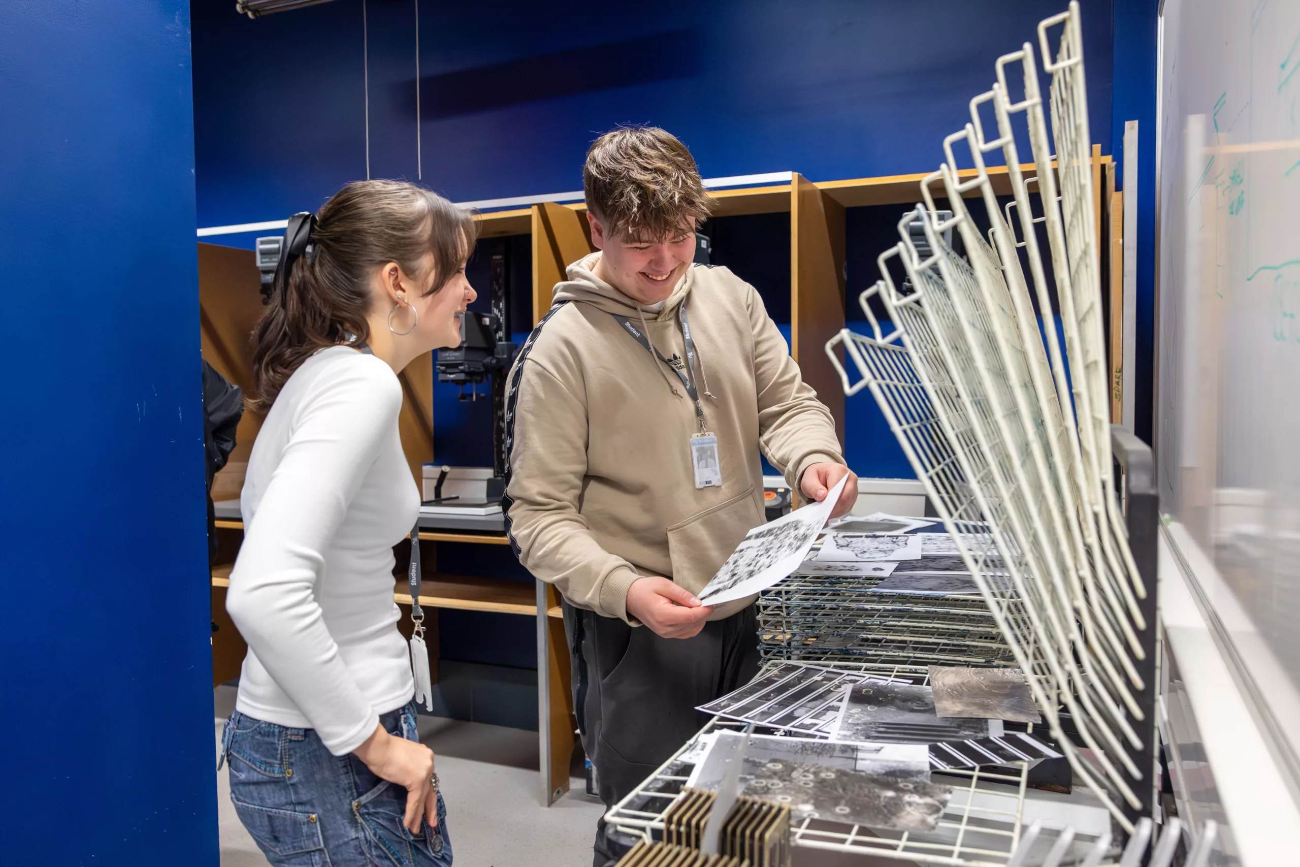Two students looking at artwork