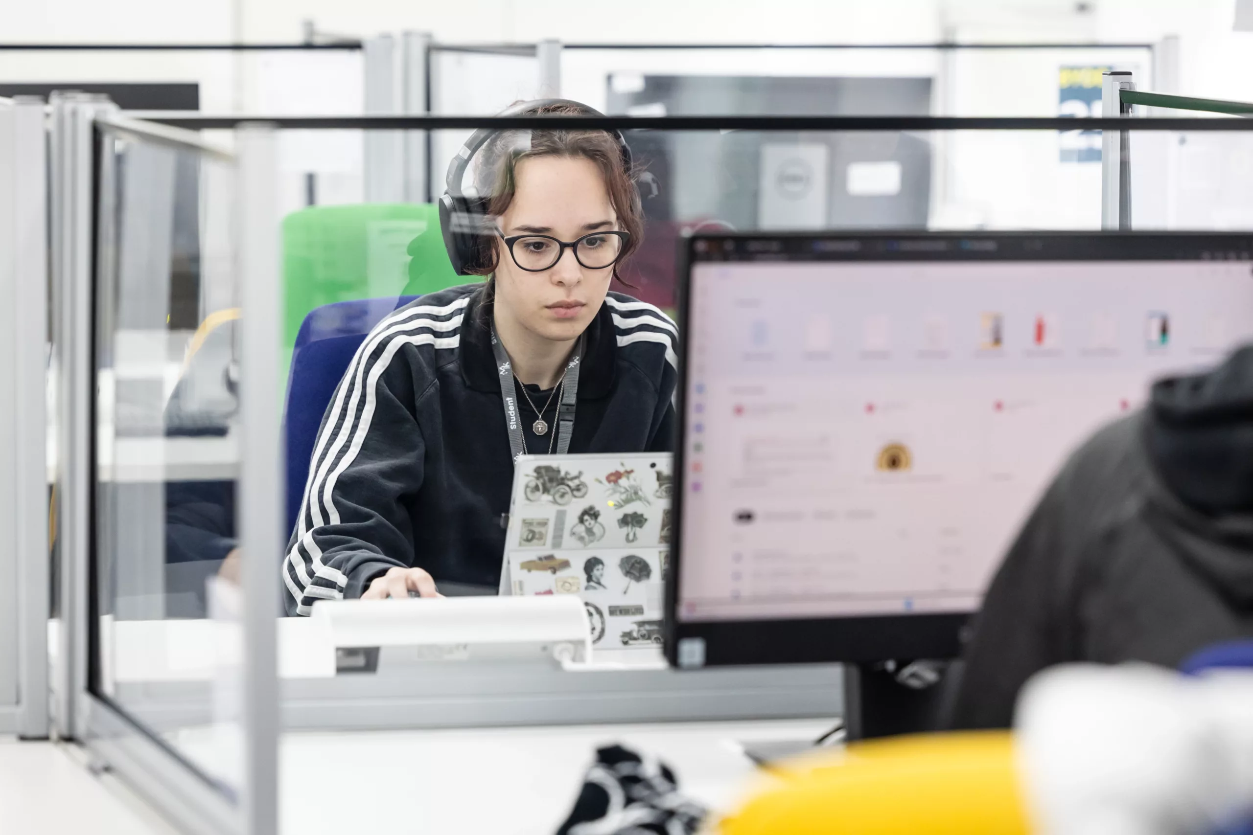 A student using a computer in a learning environment.