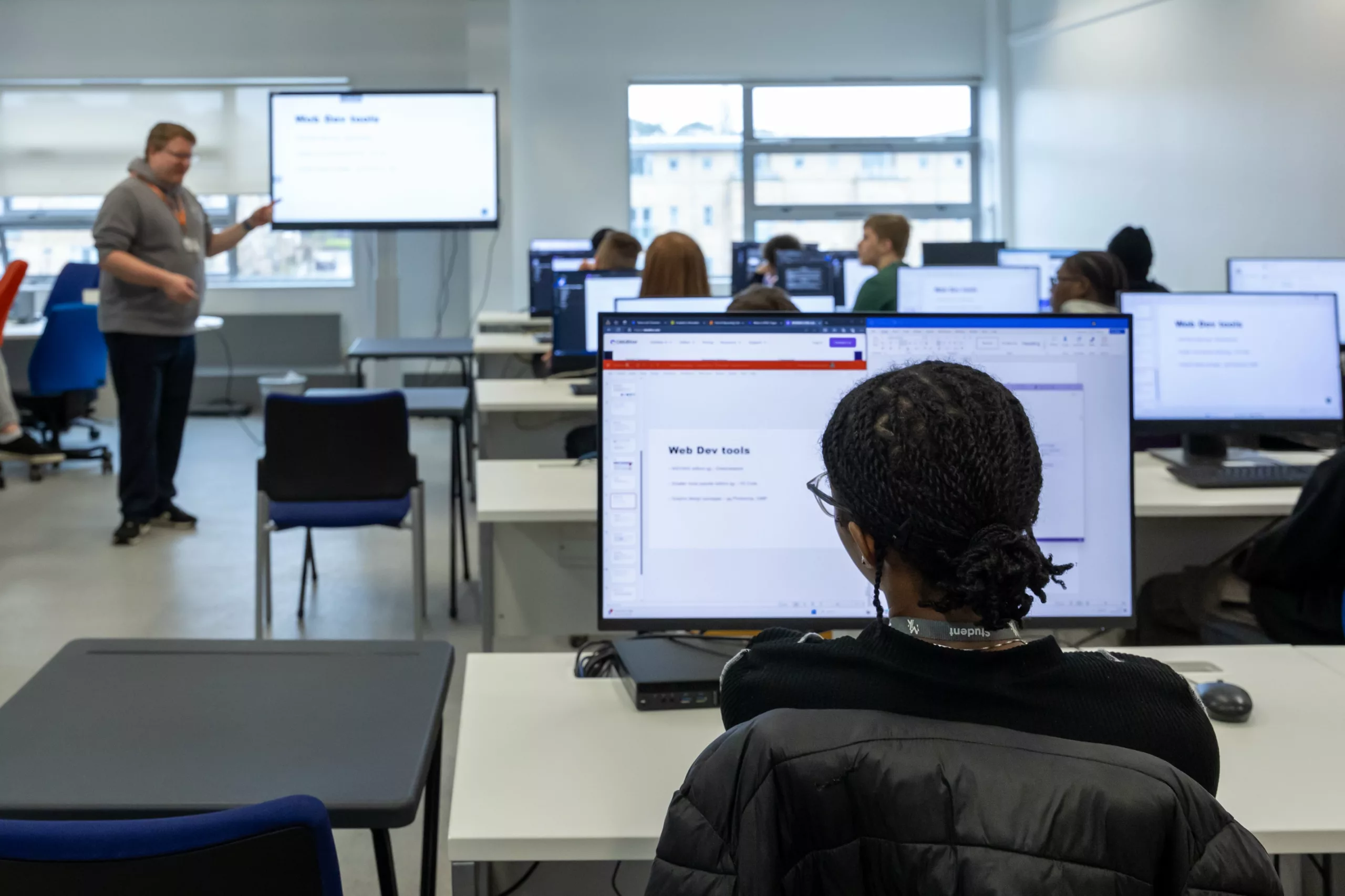 College student designing on a digital screen – A learner working on a graphic design project.