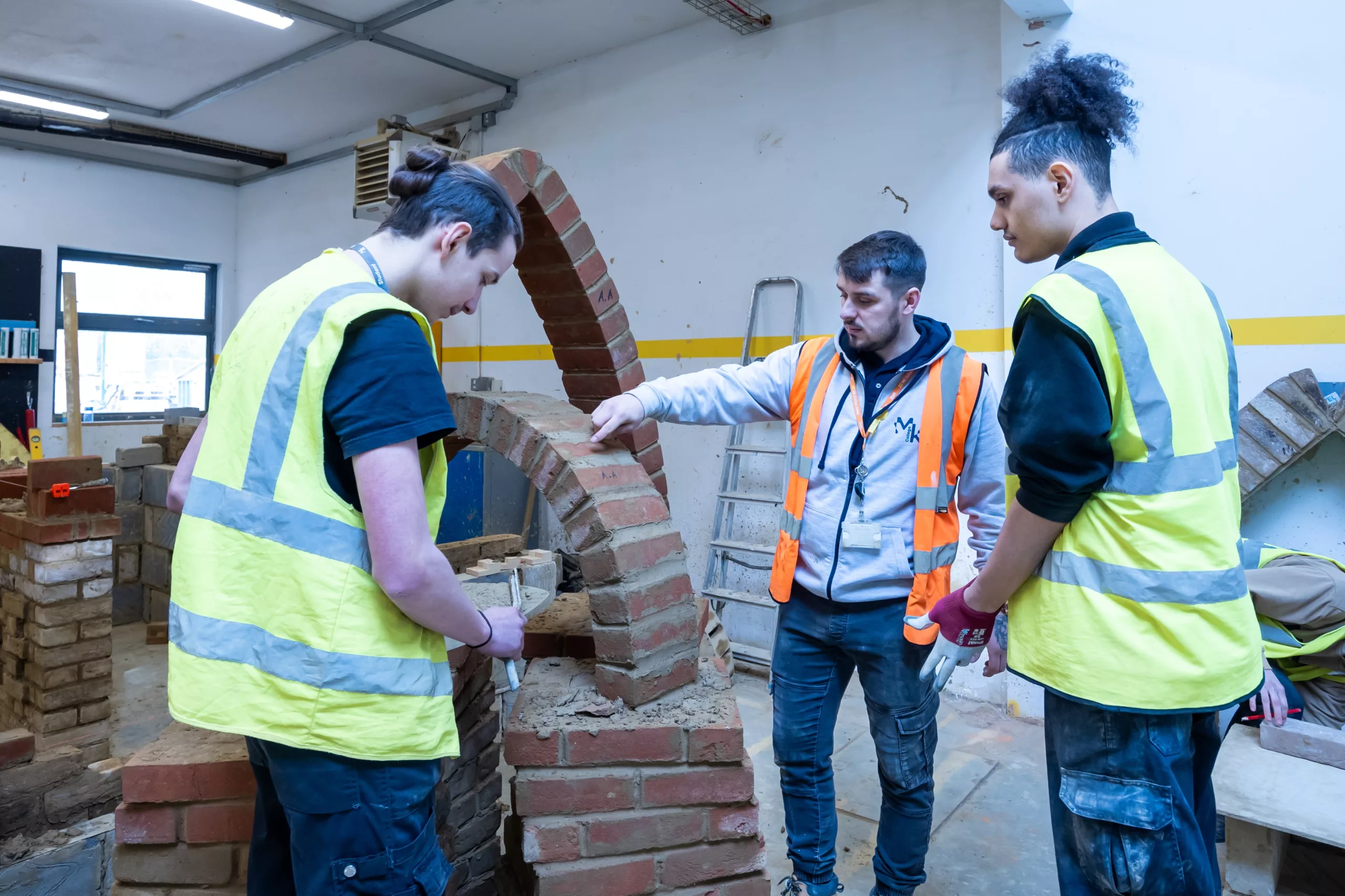A group of students collaborating on a construction project.