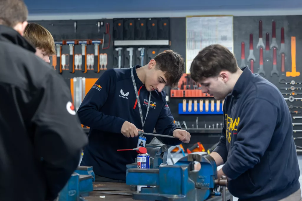 automotive students working in a garage