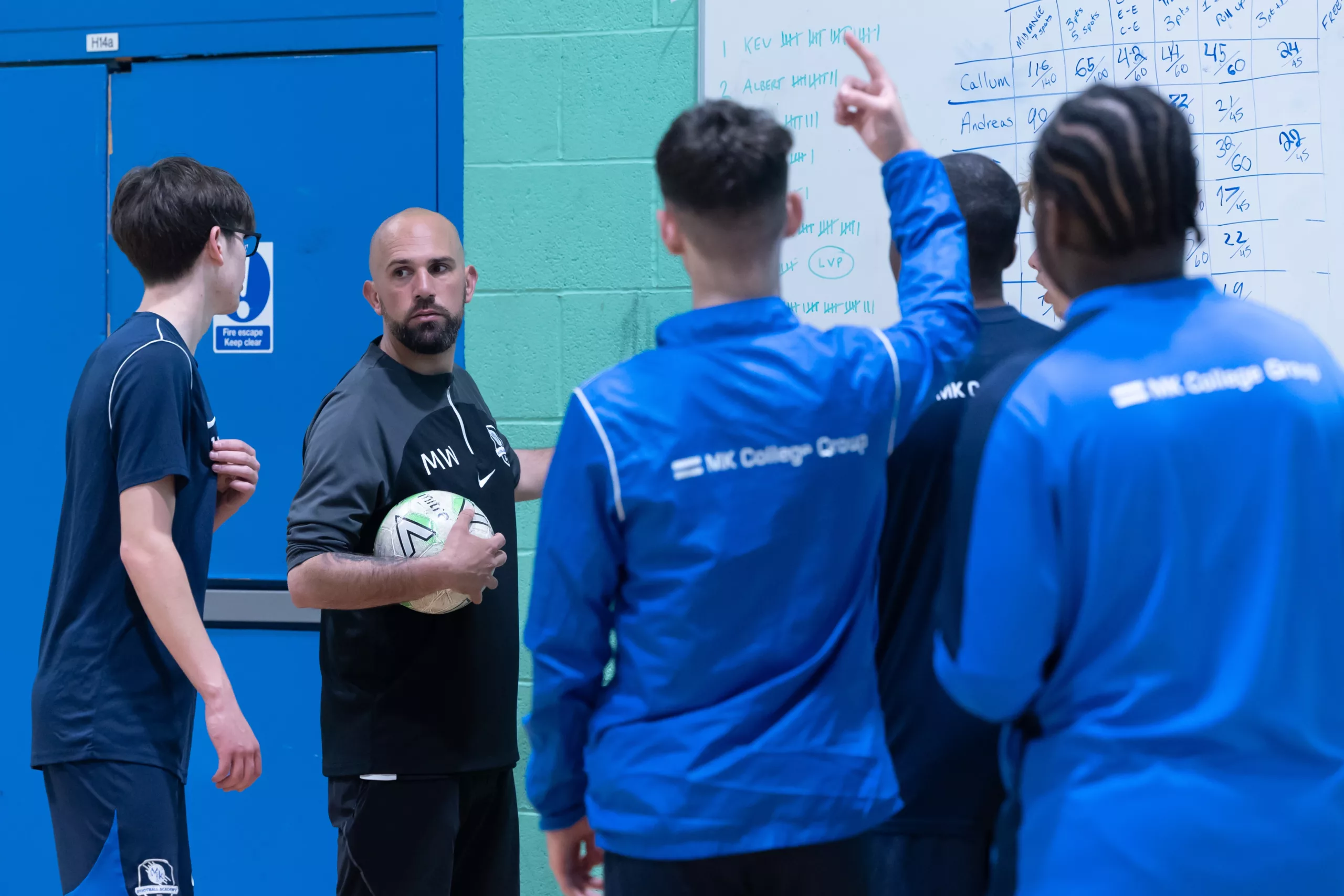 A basketball game in a gymnasium.