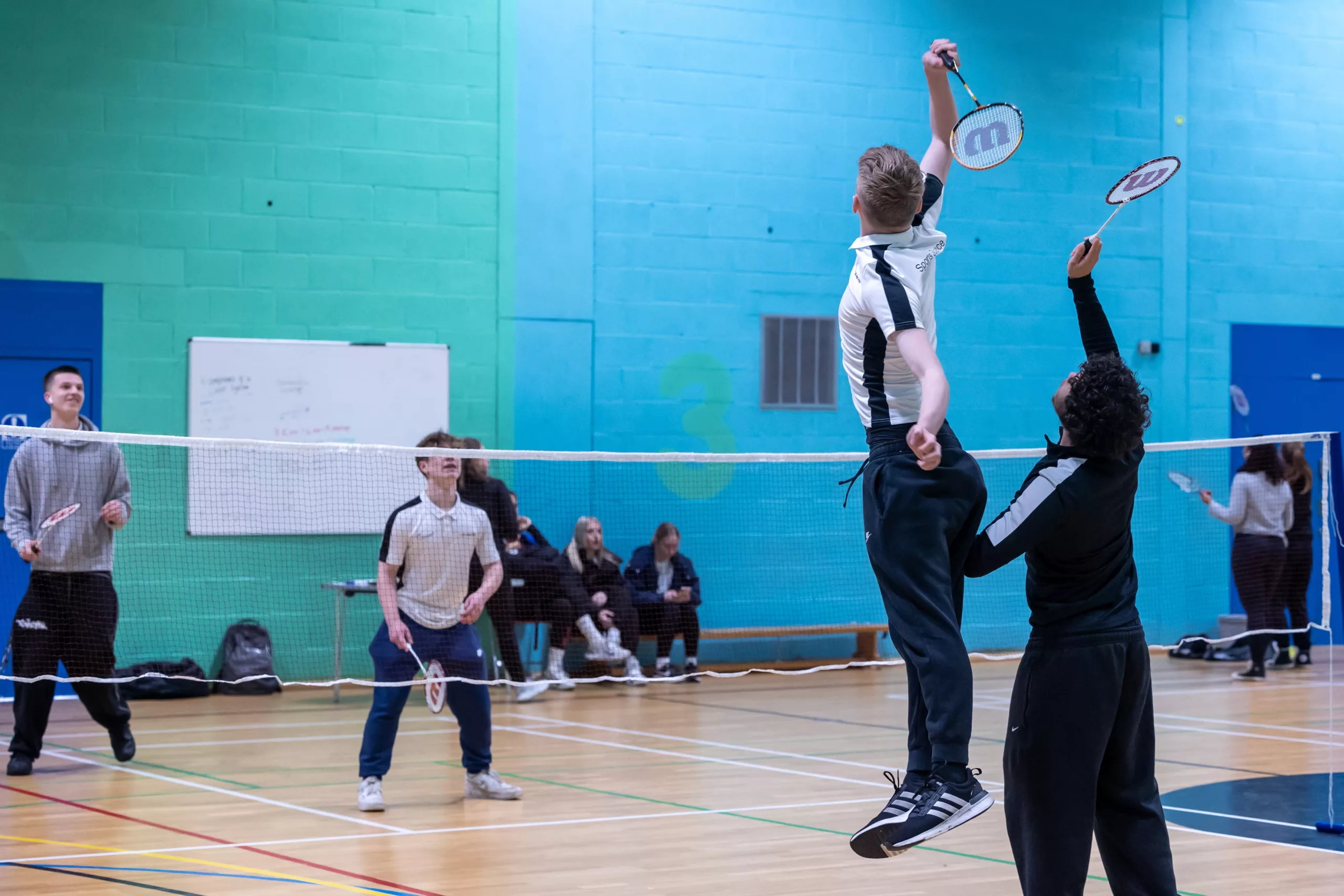 Sports students playing badminton